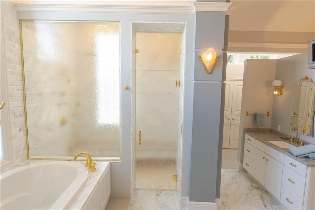 245 Saunders Station Road Trafford, PA 15085 - Photo 13 of 25 a bathroom with a bathtub and a sink