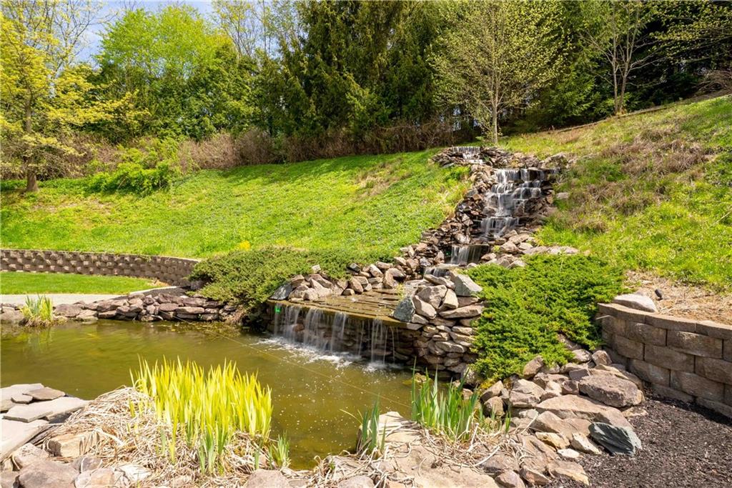 245 Saunders Station Road Trafford, PA 15085 - Photo 18 of 25 a view of a lake with a large trees
