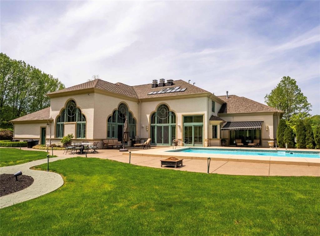 245 Saunders Station Road Trafford, PA 15085 - Photo 3 of 25 a view of a house with a backyard