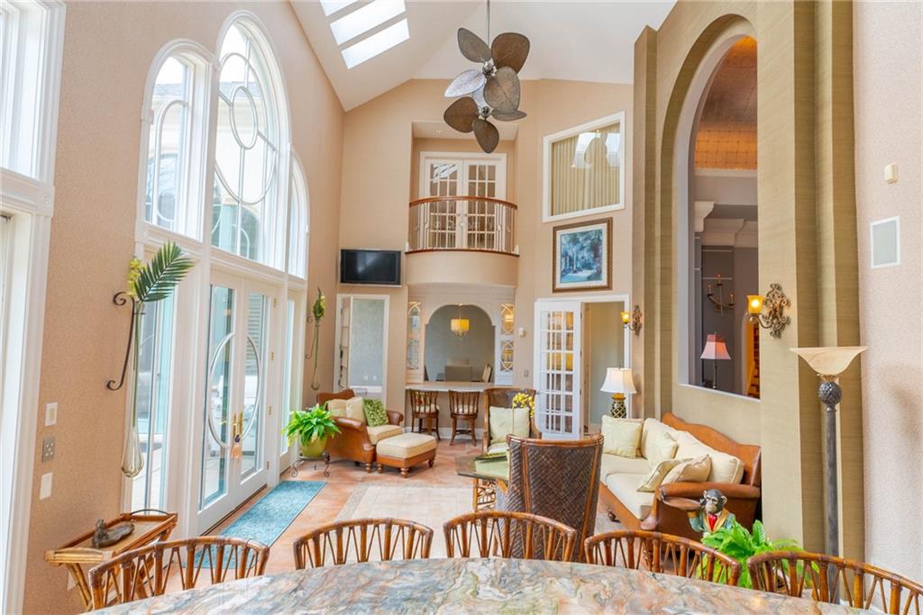 245 Saunders Station Road Trafford, PA 15085 - Photo 21 of 25 a living room with furniture a large window and a chandelier
