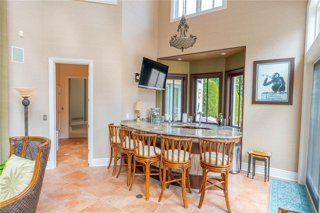 245 Saunders Station Road Trafford, PA 15085 - Photo 22 of 25 a view of a dining room with furniture window and wooden floor