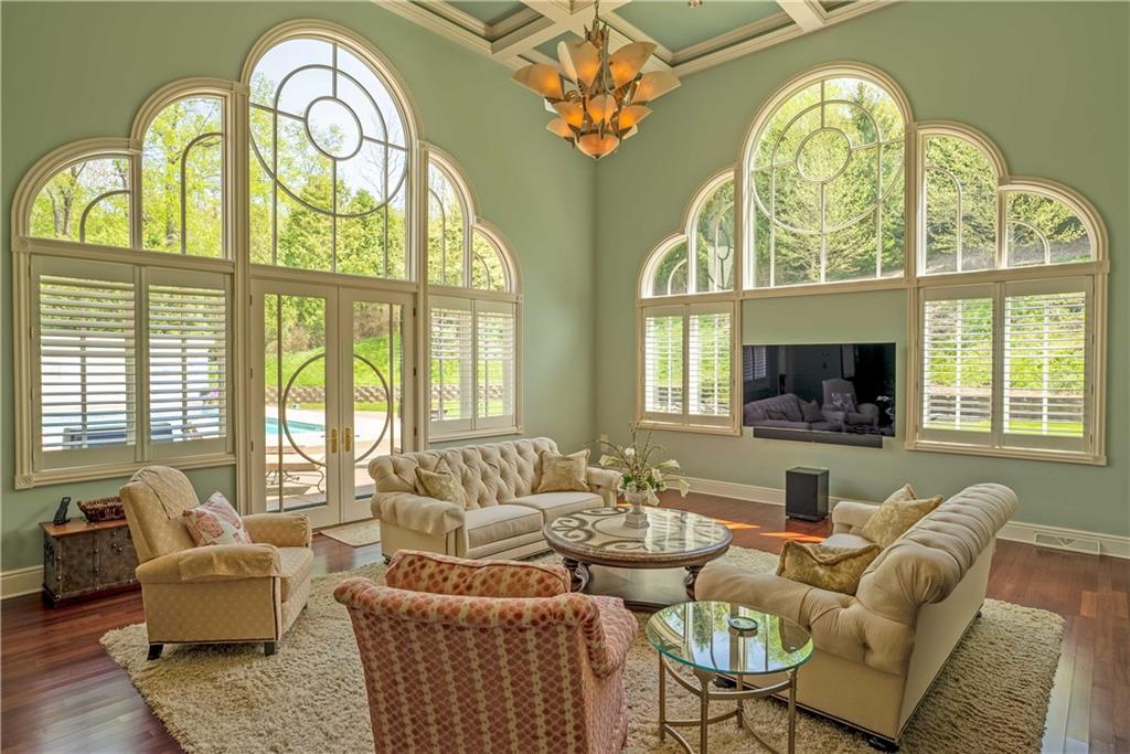 245 Saunders Station Road Trafford, PA 15085 - Photo 7 of 25 a living room with furniture fireplace and a large window