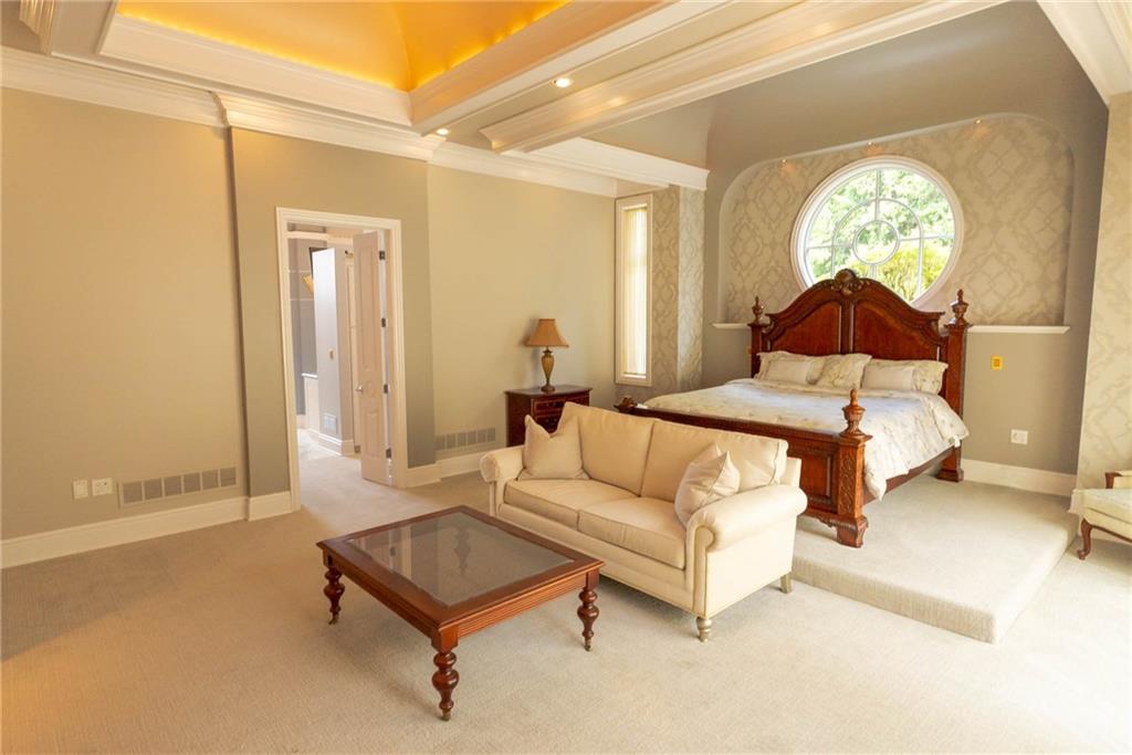 245 Saunders Station Road Trafford, PA 15085 - Photo 10 of 25 a living room with furniture and a chandelier