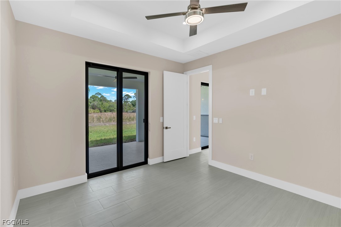 6029 Keystone Circle LaBelle, FL 33935 - Photo 32 of 50 wooden floor in an empty room with a window
