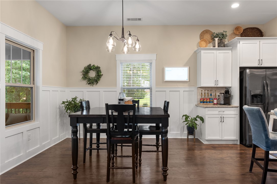201 Hearthstone Drive Anderson, SC 29621 - Photo 13 of 49 Hardwood floors and wainscoting enhance this cheerful kitchen, bathed in natural light.