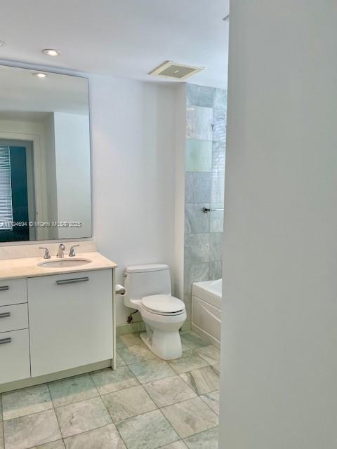 1050 Brickell Avenue, Unit 1602 Miami, FL 33131 - Photo 17 of 21 a bathroom with a sink toilet and shower