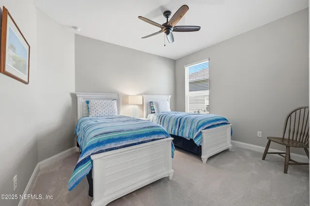 a bedroom with a bed and a chair