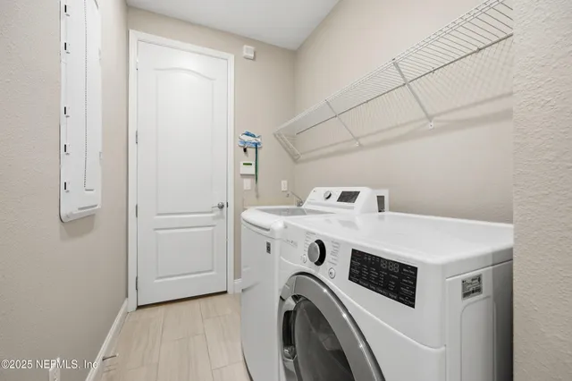 a utility room with dryer and washer