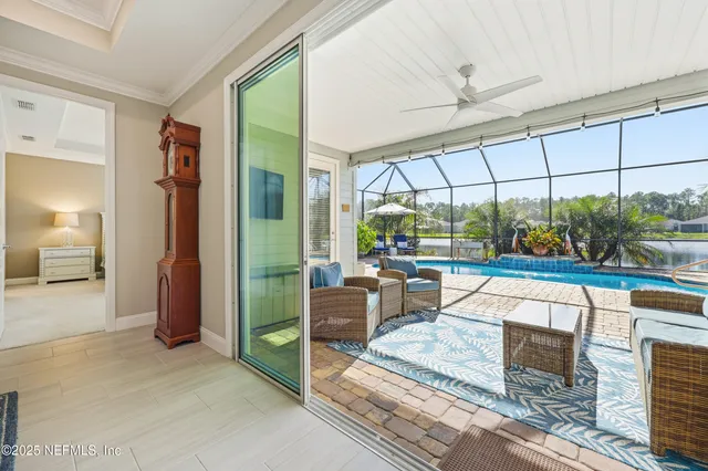 a view of a swimming pool with sitting area
