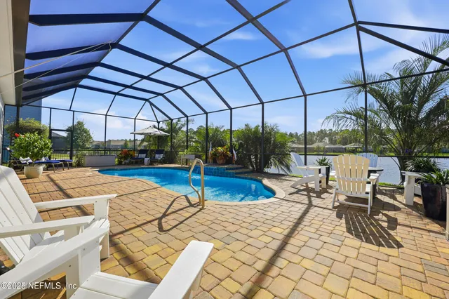 a view of living room with kitchen island furniture and a potted plant