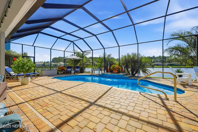 a view of a lake with houses in the back