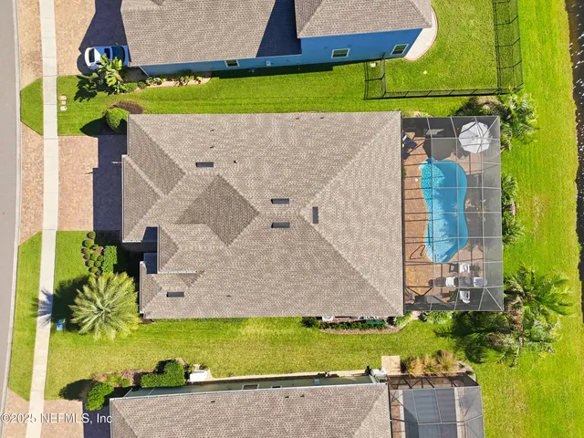a view of swimming pool with a sitting area