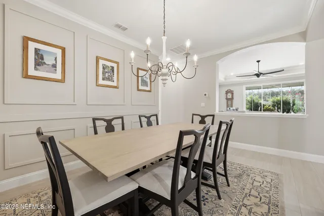 a view of a dining room with furniture and window