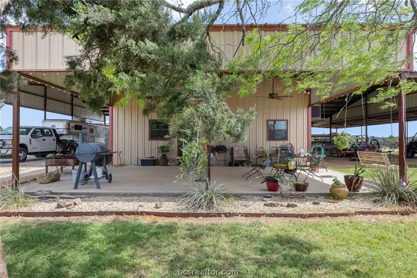 a view of a backyard with a patio