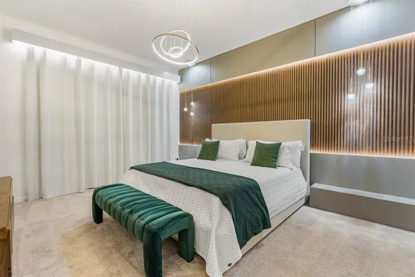 a bedroom with a bed and curtain