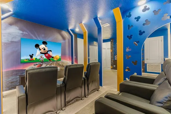 a living room with furniture and flowers