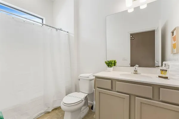 a bathroom with a sink toilet and vanity