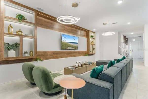 a living room with furniture and a large window