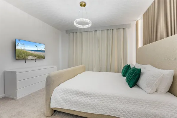 a bedroom with a bed and window