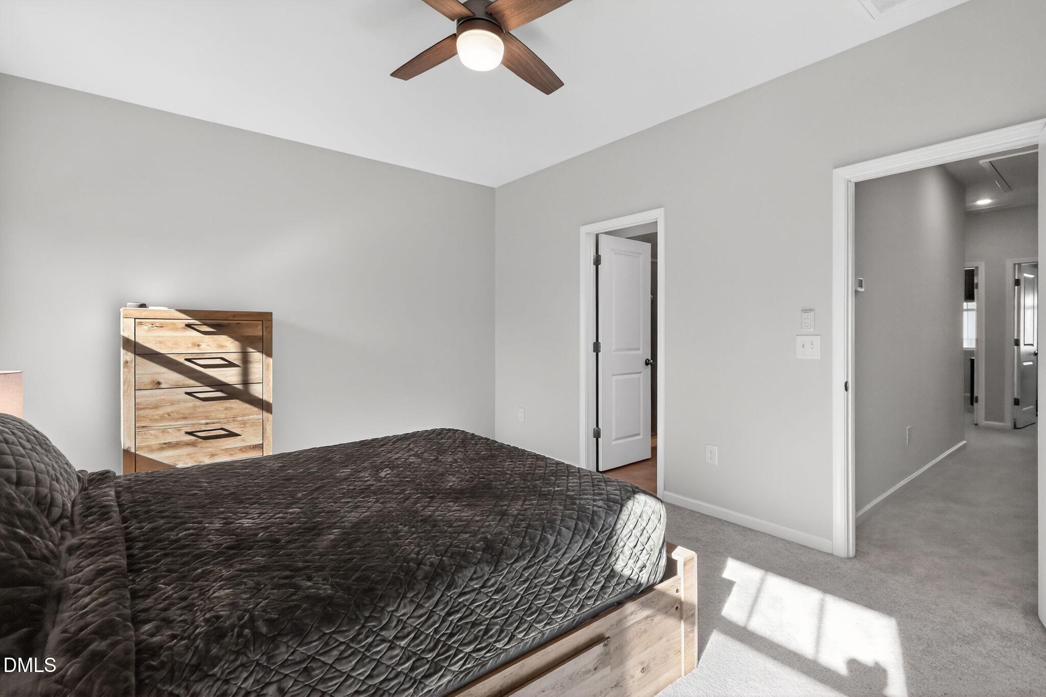 1118 Commack Drive Durham, NC 27703 - Photo 10 of 30 a bedroom with a bed and a painting on the wall