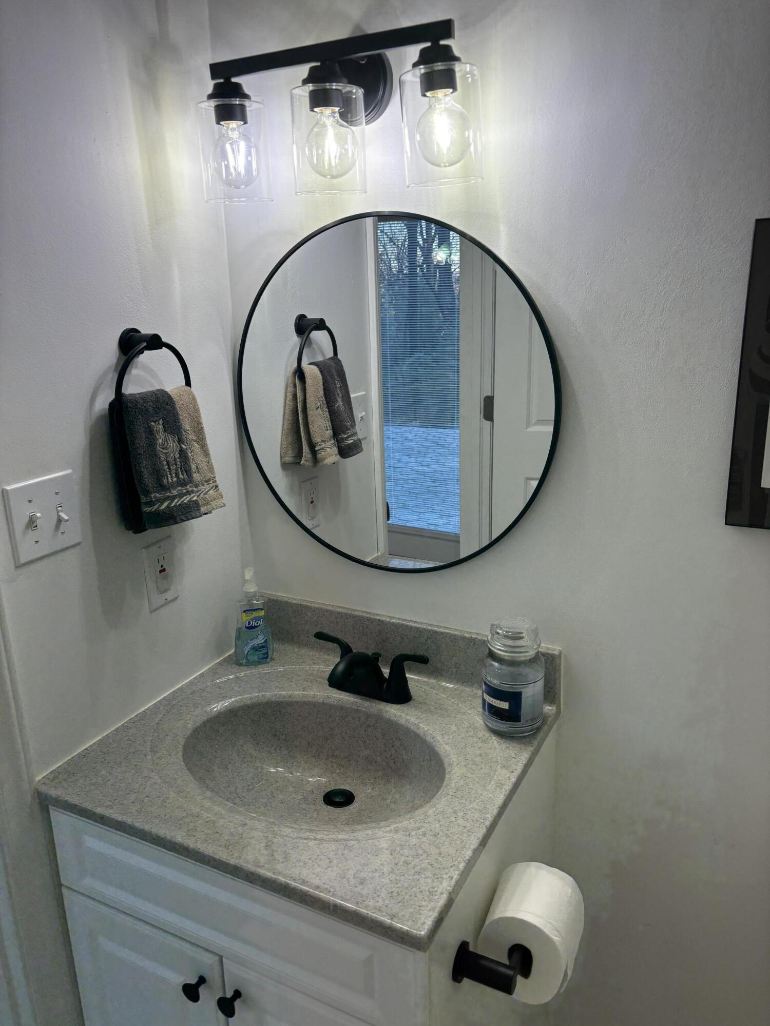36 York Street Roanoke, VA 24019 - Photo 45 of 90 a bathroom with a sink and mirror