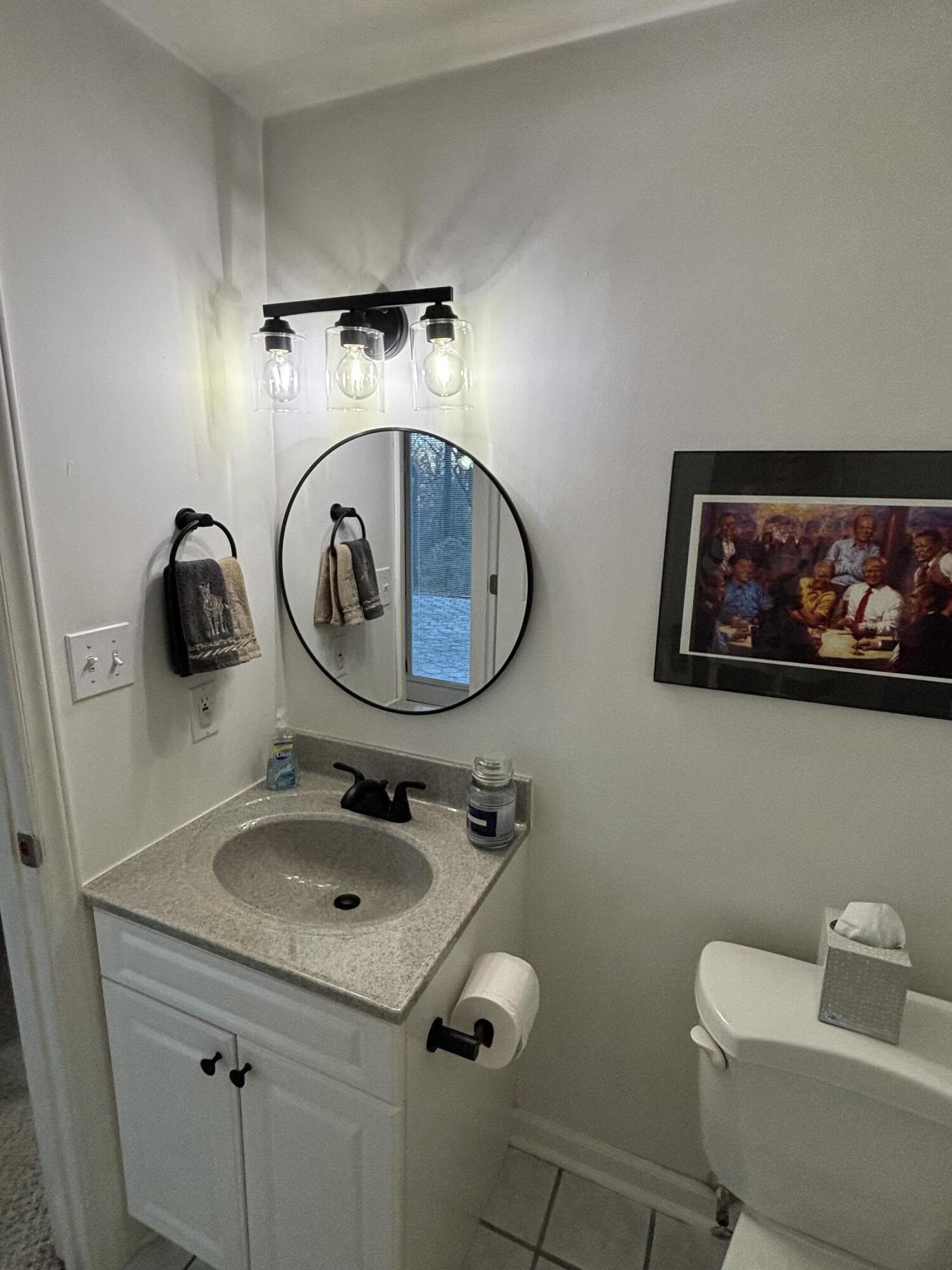 36 York Street Roanoke, VA 24019 - Photo 46 of 90 a bathroom with a toilet a sink and a mirror