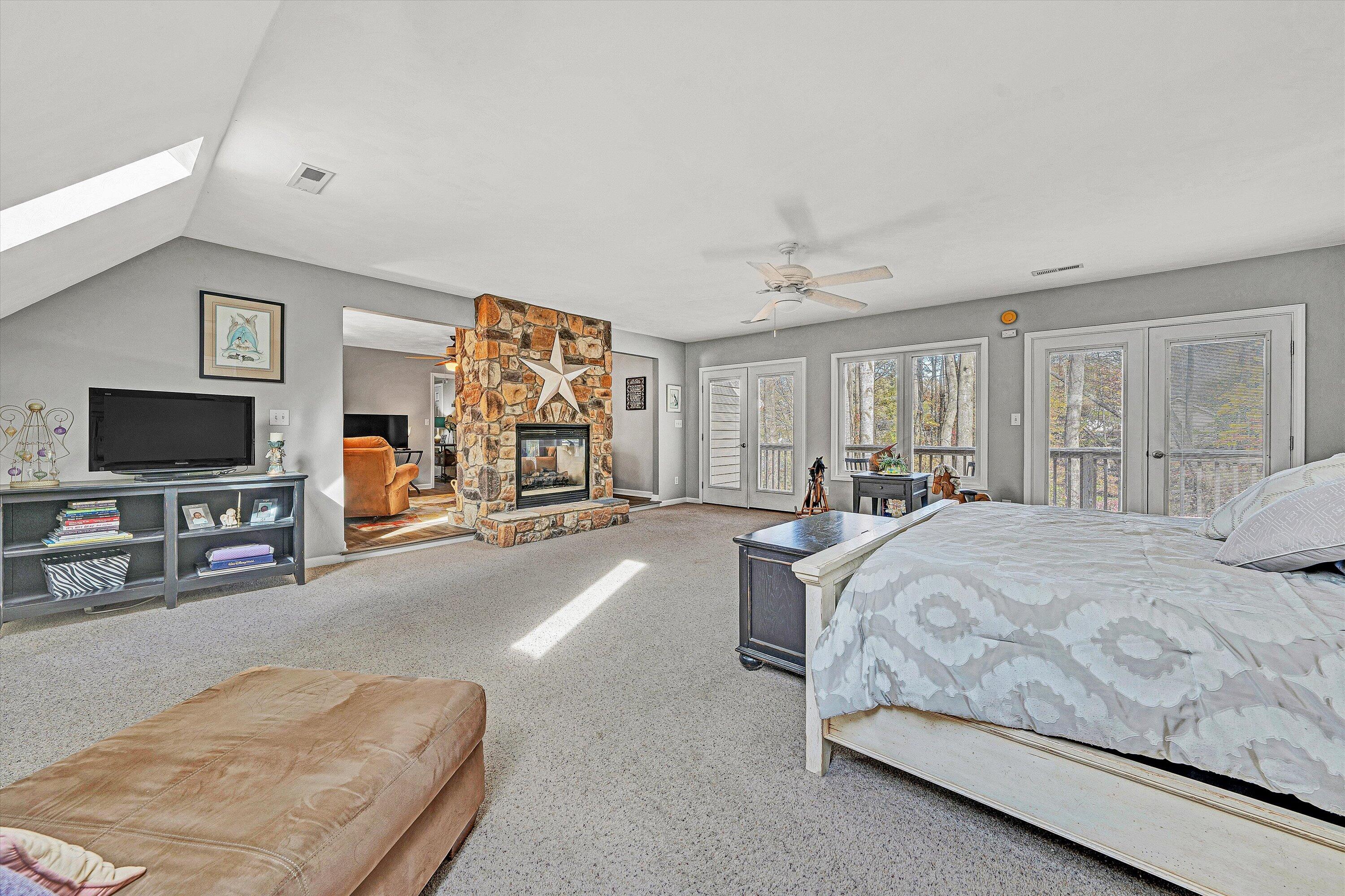 36 York Street Roanoke, VA 24019 - Photo 10 of 90 a spacious bedroom with a bed and a flat screen television