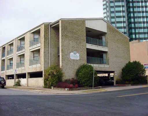 2000 Whitis Avenue, Unit 309 Austin, TX 78705 - Photo 1 of 1 a front view of a building with a garden