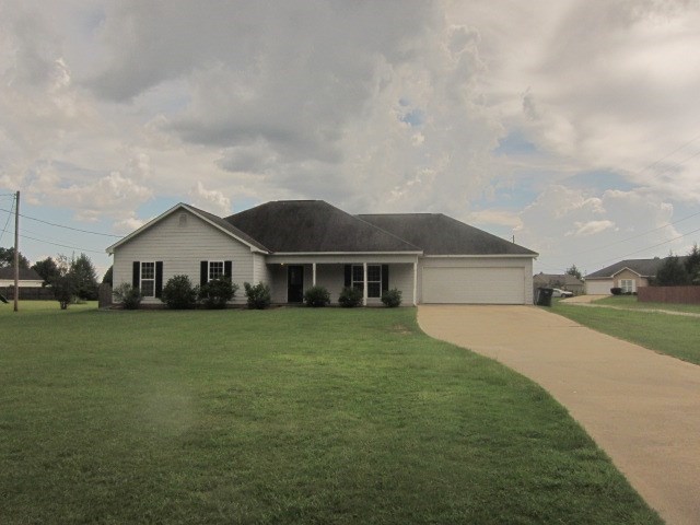 162 Owens Road Fort Mitchell, AL 36856 - Photo 1 of 13 a front view of a house with a yard and garage