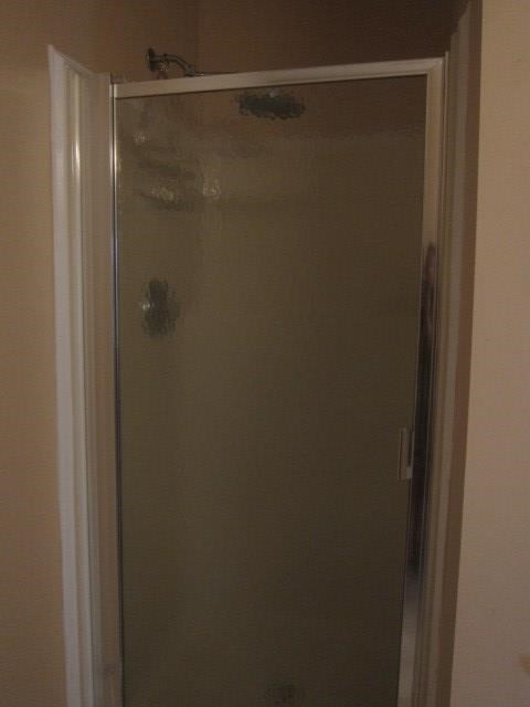 162 Owens Road Fort Mitchell, AL 36856 - Photo 7 of 13 a bathroom with a glass shower door