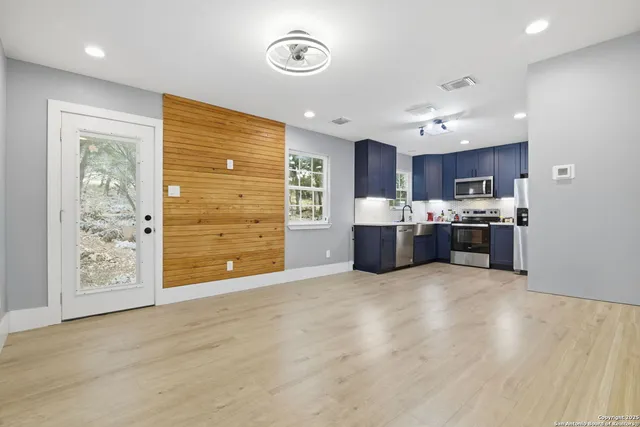 a view of kitchen and kitchen with furniture