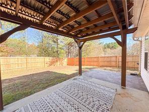 390 Cedarhurst Road Lawrenceville, GA 30045 - Photo 3 of 3 a view of an empty room with a large window