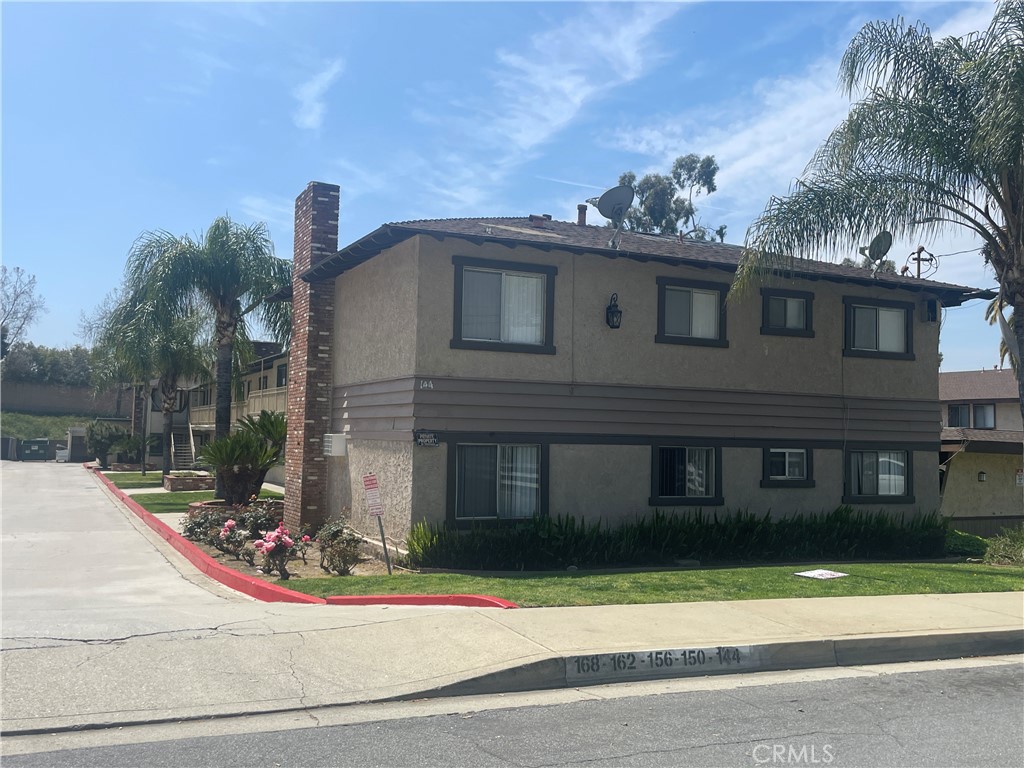 144 West Baseline Road, Unit 8 San Dimas, CA 91773 - Photo 1 of 9 a view of a house with a yard