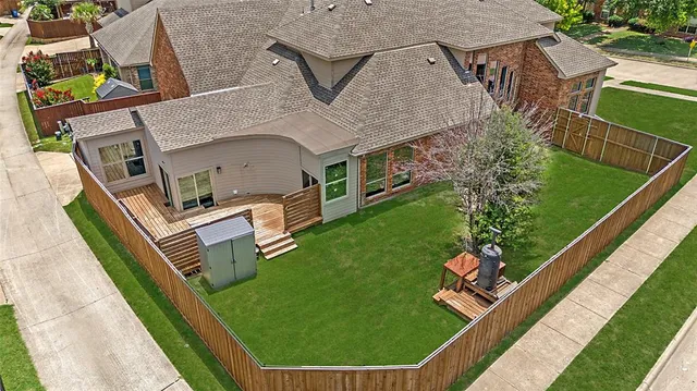 an aerial view of a house with garden