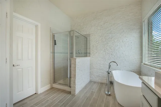 a bathroom with a sink and shower