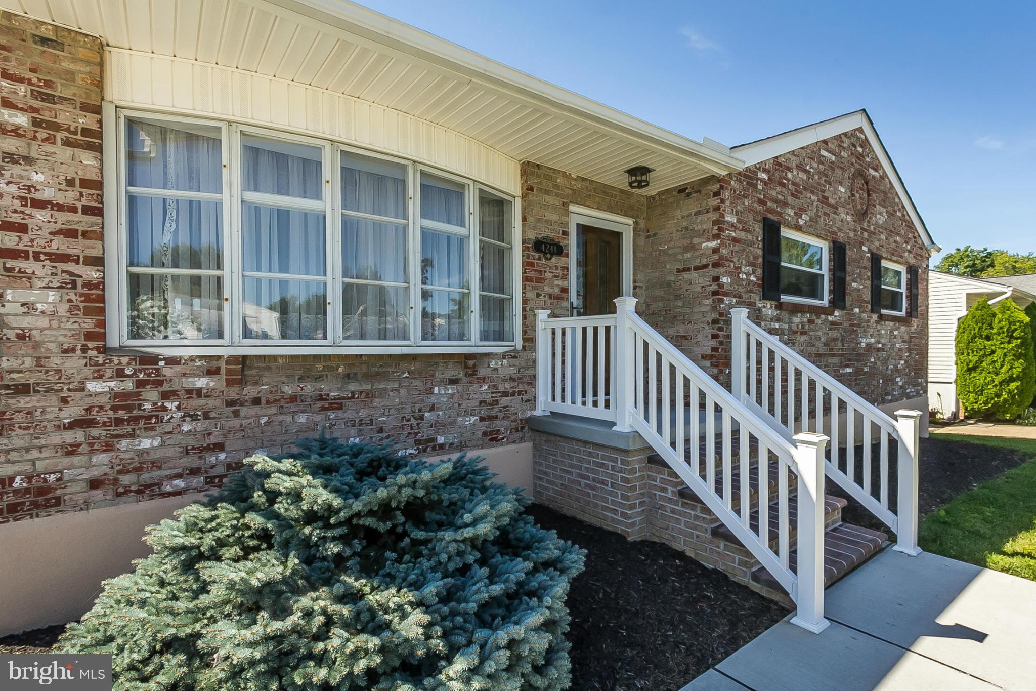4241 4 Mills Road Baltimore, MD 21236 - Photo 2 of 25 a view of a brick house with front of a house