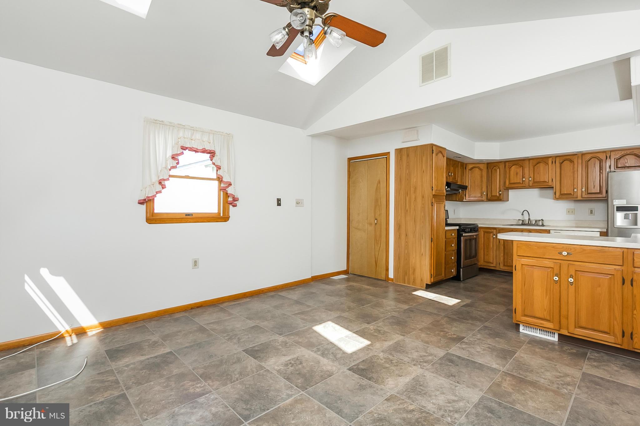 4241 4 Mills Road Baltimore, MD 21236 - Photo 9 of 25 a view of kitchen with stainless steel appliances granite countertop a refrigerator and a sink