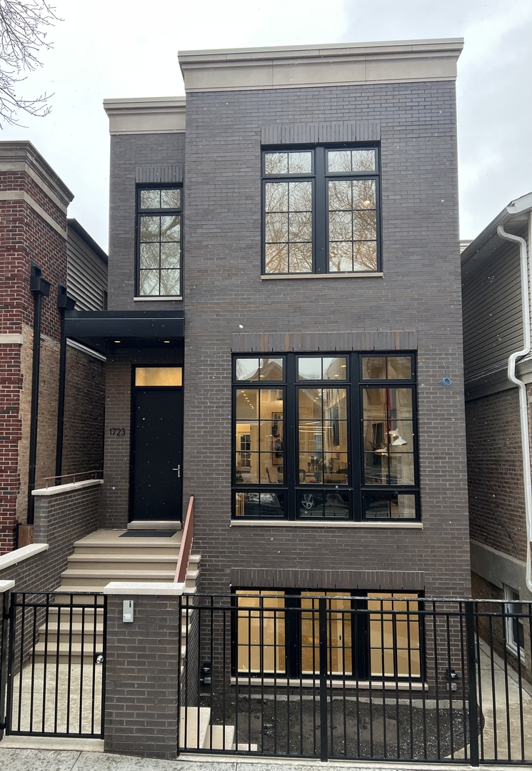 a front view of a building with a lot of windows