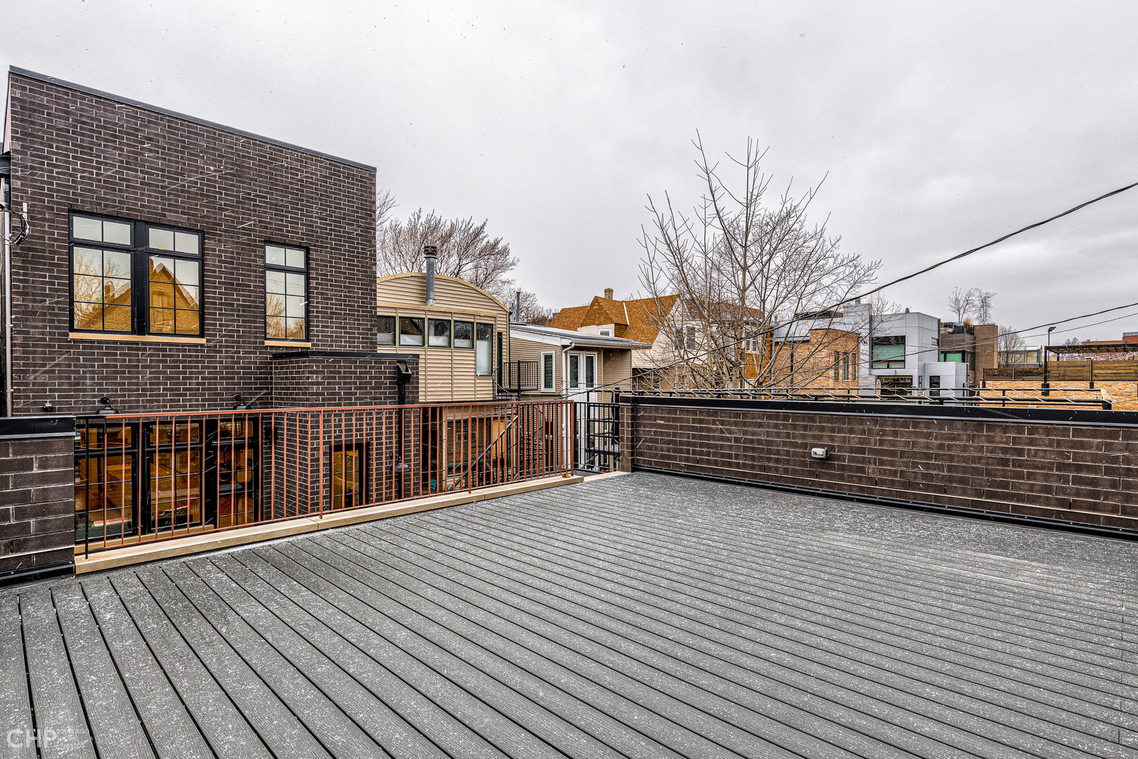 Undisclosed Address Chicago, IL 60622 - Photo 17 of 17 a view of a house with a roof deck