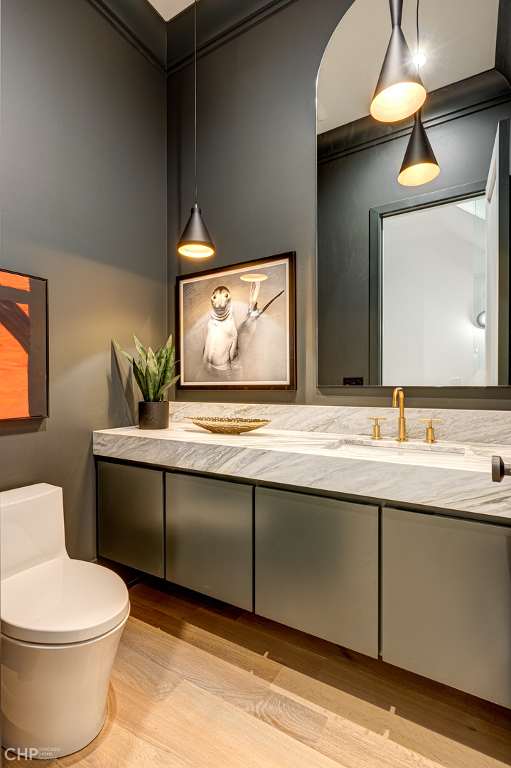 Undisclosed Address Chicago, IL 60622 - Photo 6 of 17 a bathroom with a toilet sink and mirror