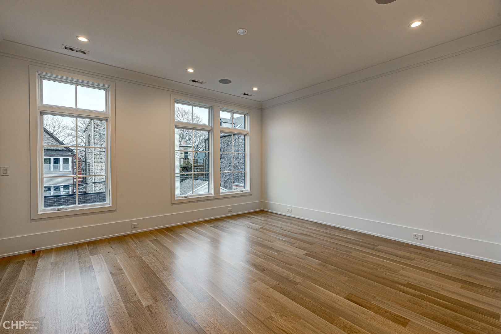 Undisclosed Address Chicago, IL 60622 - Photo 7 of 17 a view of an empty room with wooden floor and a window
