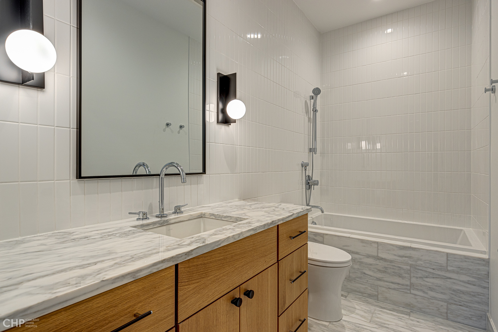 Undisclosed Address Chicago, IL 60622 - Photo 10 of 17 a bathroom with a granite countertop sink mirror vanity and toilet