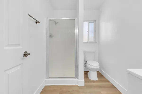 a white toilet sitting next to a bathroom sink