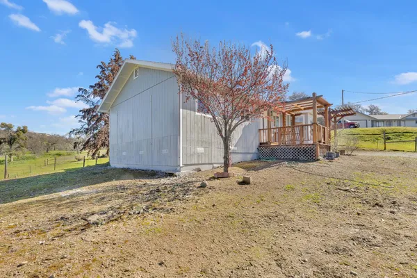 a view of a backyard of the house