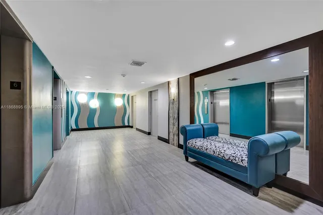 a view of swimming pool with outdoor seating and city view