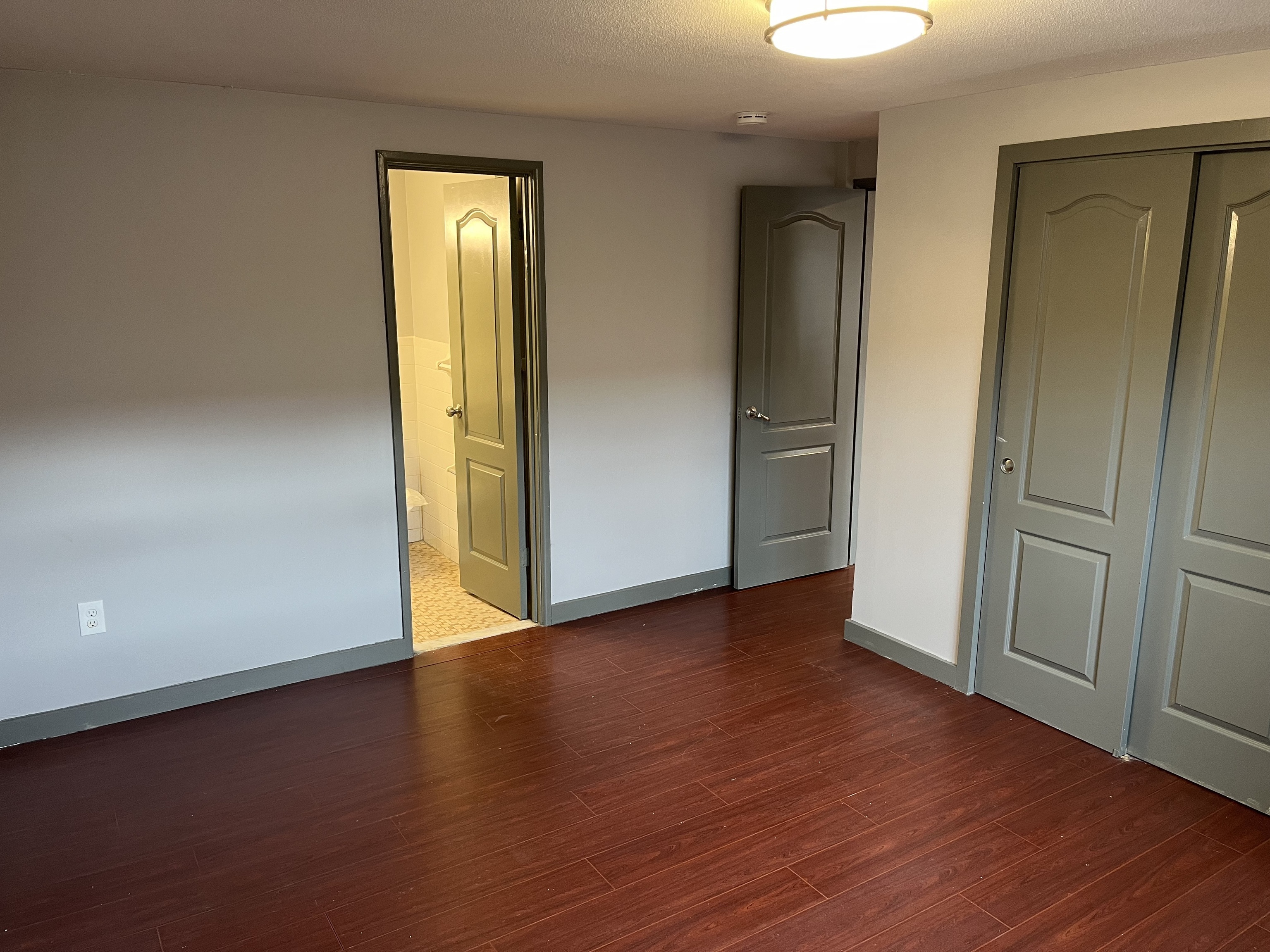 32 Cook Avenue, Unit 203 Meriden, CT 06451 - Photo 5 of 11 an empty room with wooden floor and closet