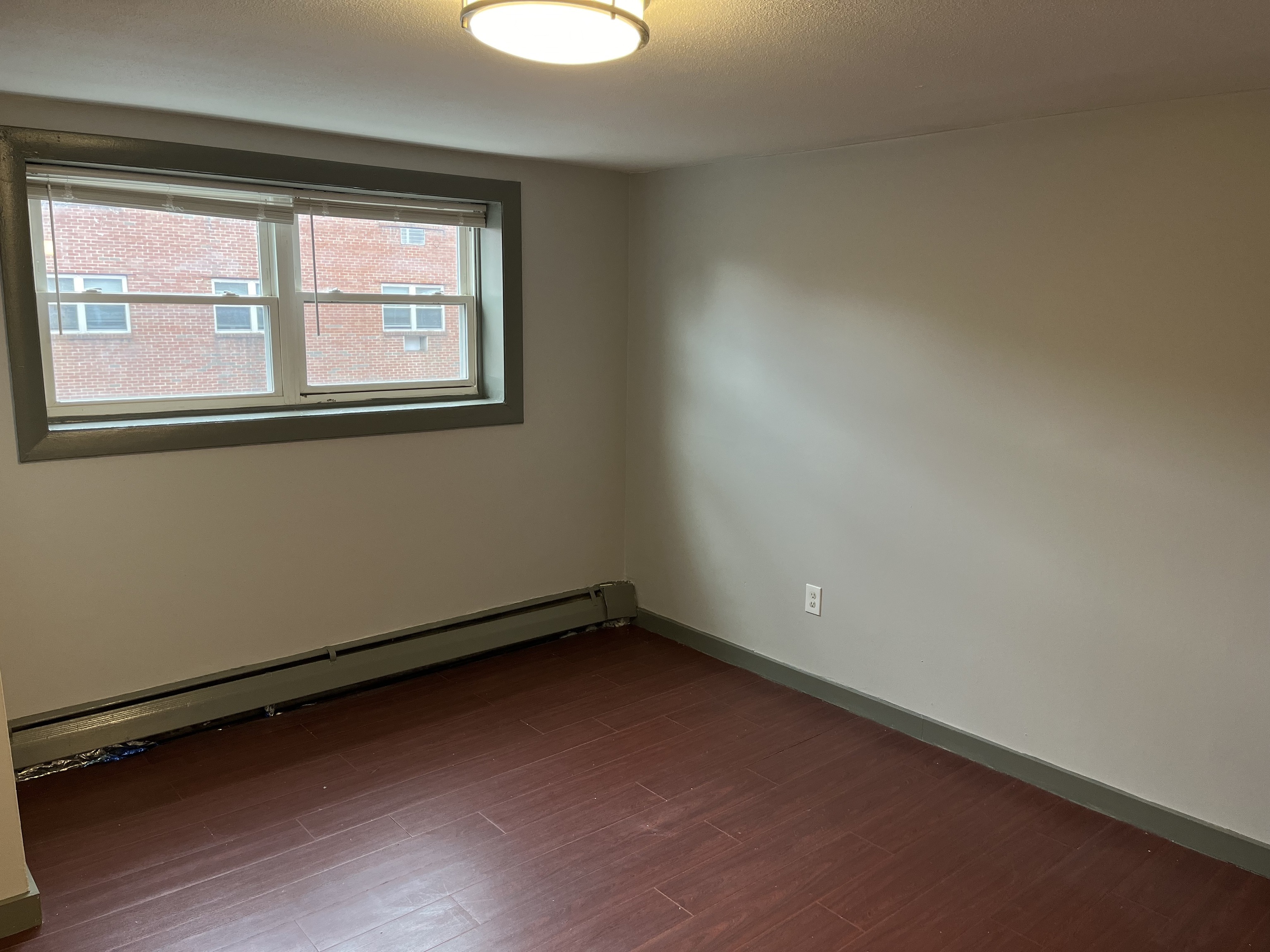 32 Cook Avenue, Unit 203 Meriden, CT 06451 - Photo 6 of 11 an empty room with a window