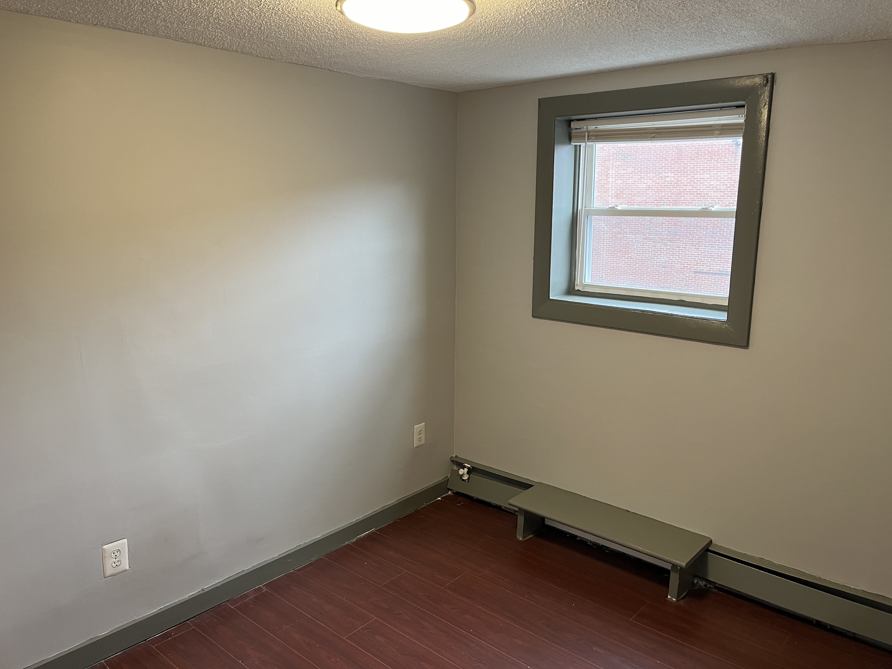 32 Cook Avenue, Unit 203 Meriden, CT 06451 - Photo 8 of 11 an empty room with a window