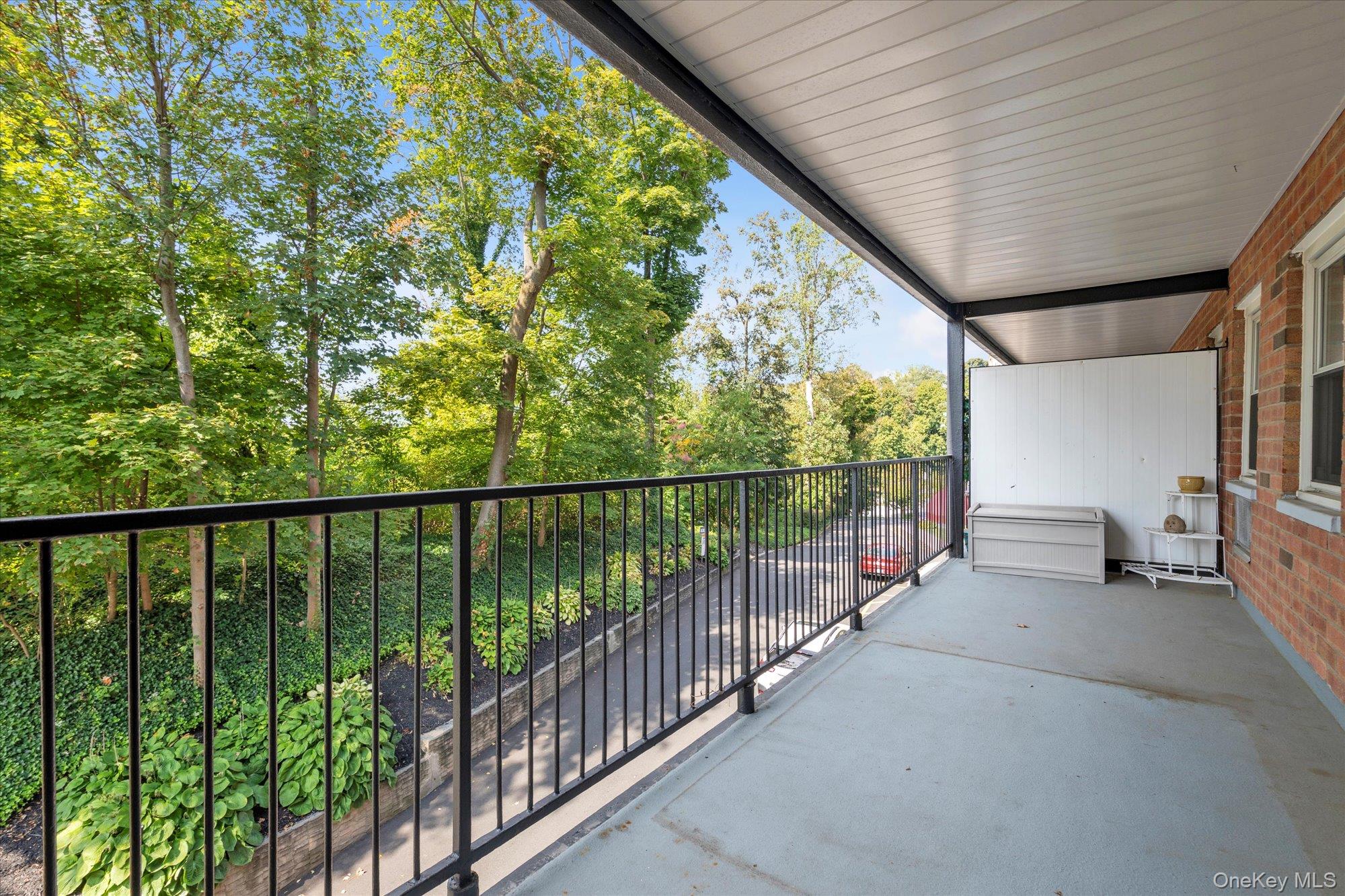 30 Pearsall Avenue, Unit 2F Glen Cove, NY 11542 - Photo 17 of 25 Spacious Balcony with view of greenery