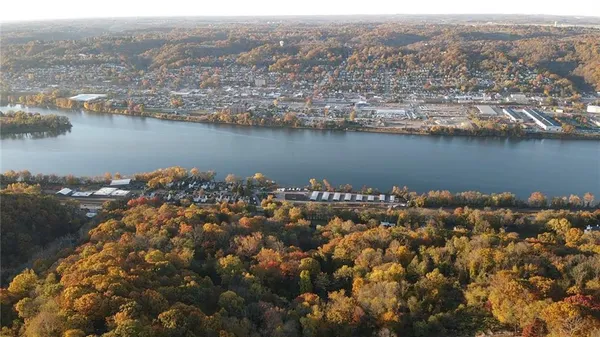 an aerial view of a house with a lake view